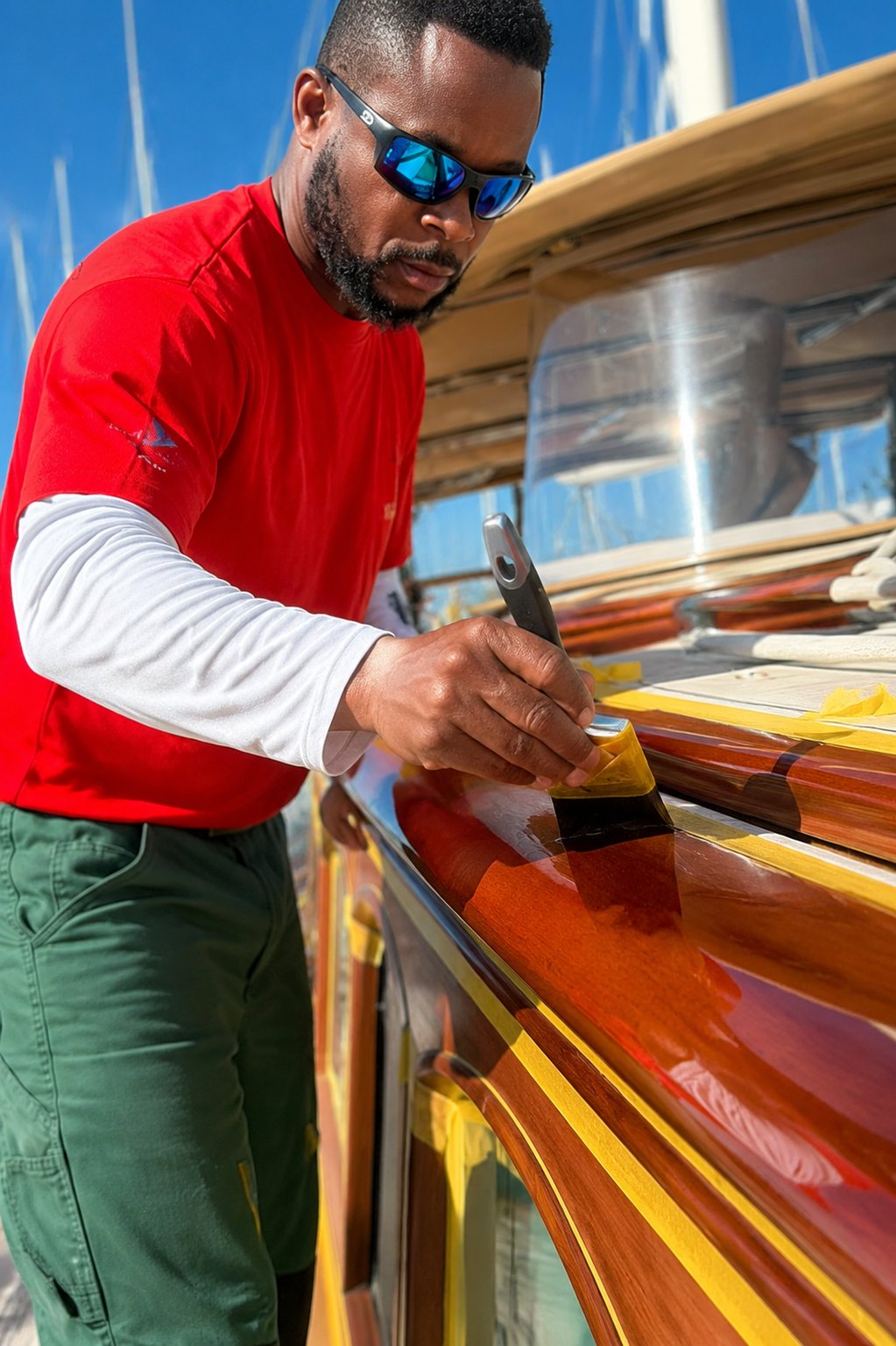 JamPro varnisher applying varnish to yacht brightwork